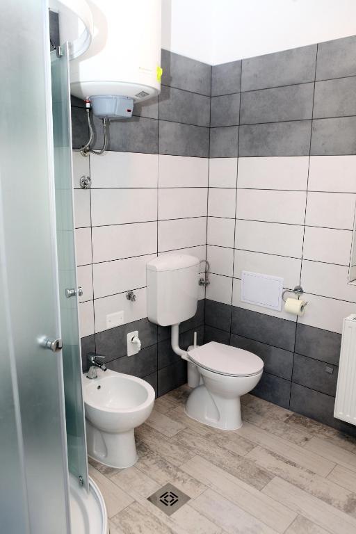 Second bathroom with toilet and bidet